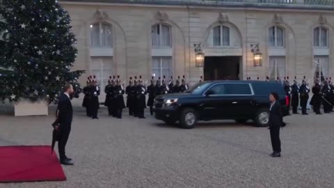 Donald Trump is greeted by French President Emmanuel Macron at the Elysee Palace