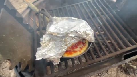 Cooking Pizza On The Campfire