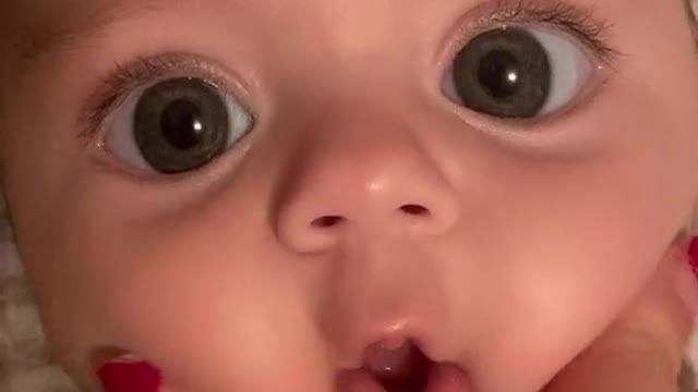 This baby is very cute and has chubby cheeks