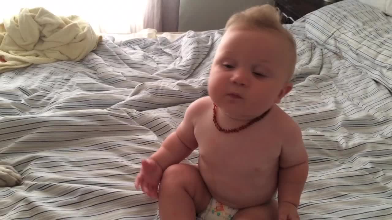 Baby thrilled to receive kisses from doggy friend