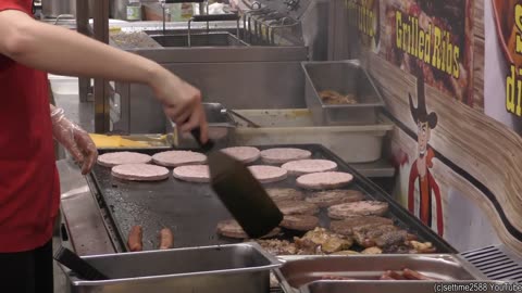 Street Food from the USA. Three Girls Master a Busy Grill of Meat