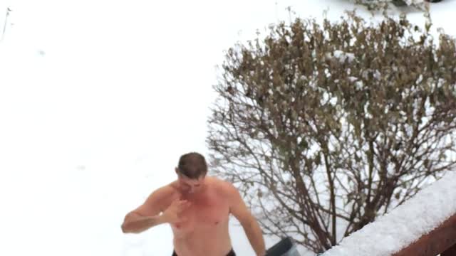 Russian man doused with cold water and dives into the snow in winter t-18