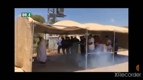 Israeli Zionist soldiers throw flash bangs and tear gas grenades at praying palestinian civilians