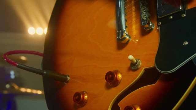 A man arranging his guitar