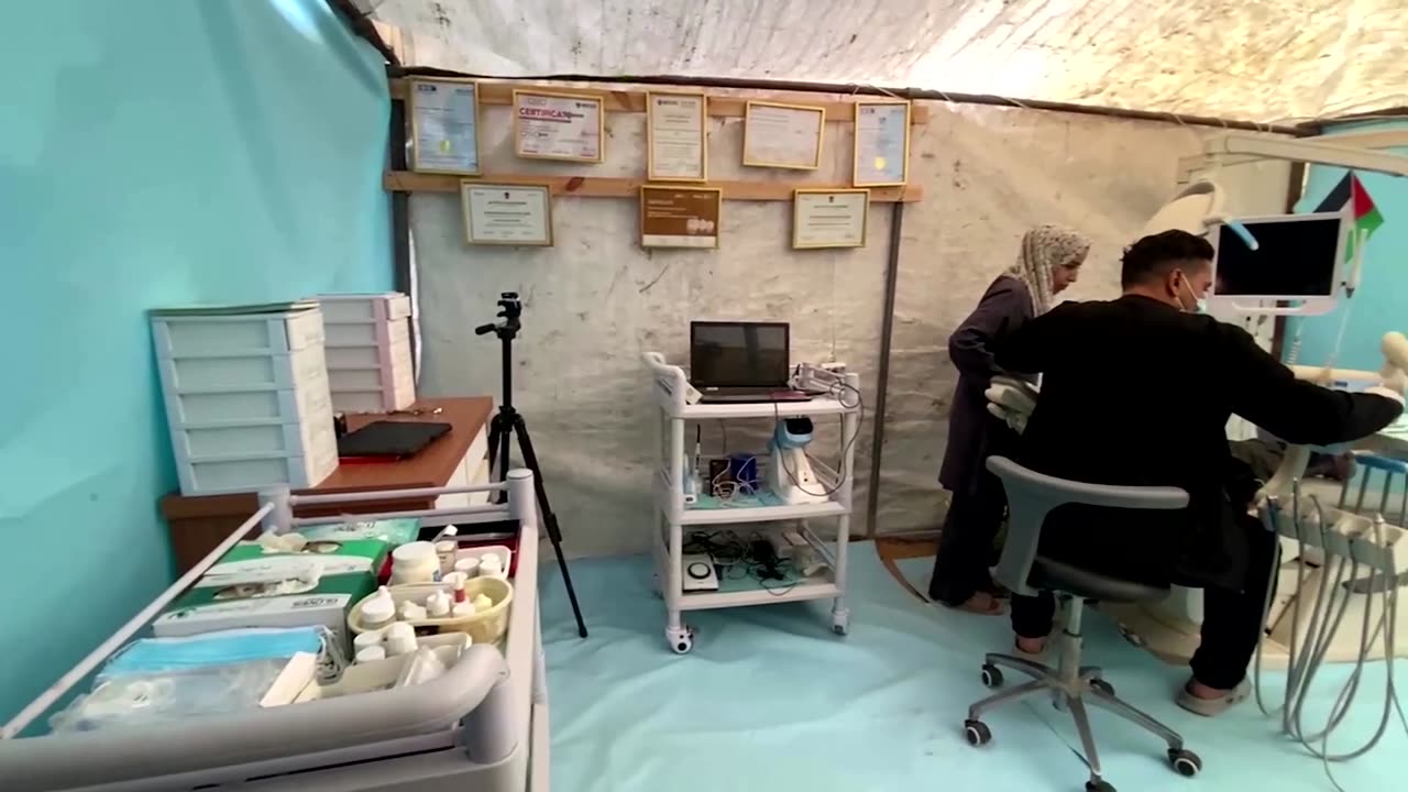 A Gaza dentist practices out of tent after clinic destroyed