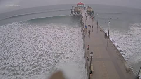 Surfers at Huntington Beach, California, seem to be enjoying Hurricane Hilary