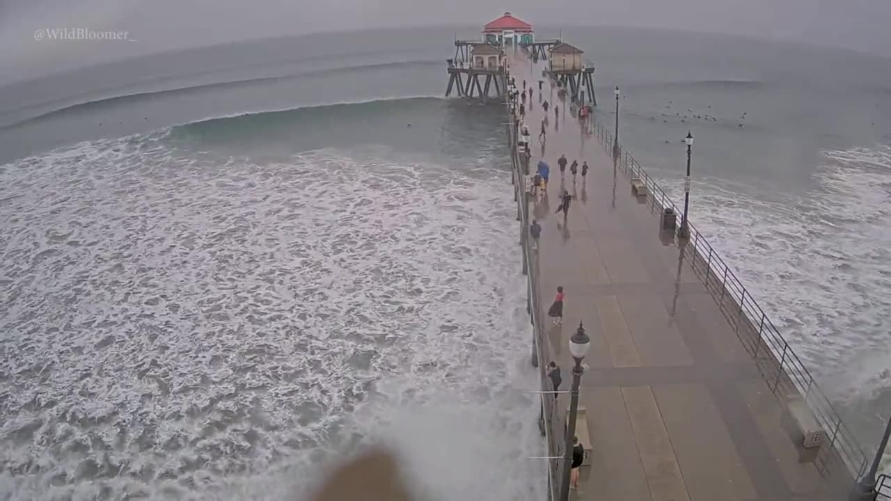 Surfers at Huntington Beach, California, seem to be enjoying Hurricane Hilary