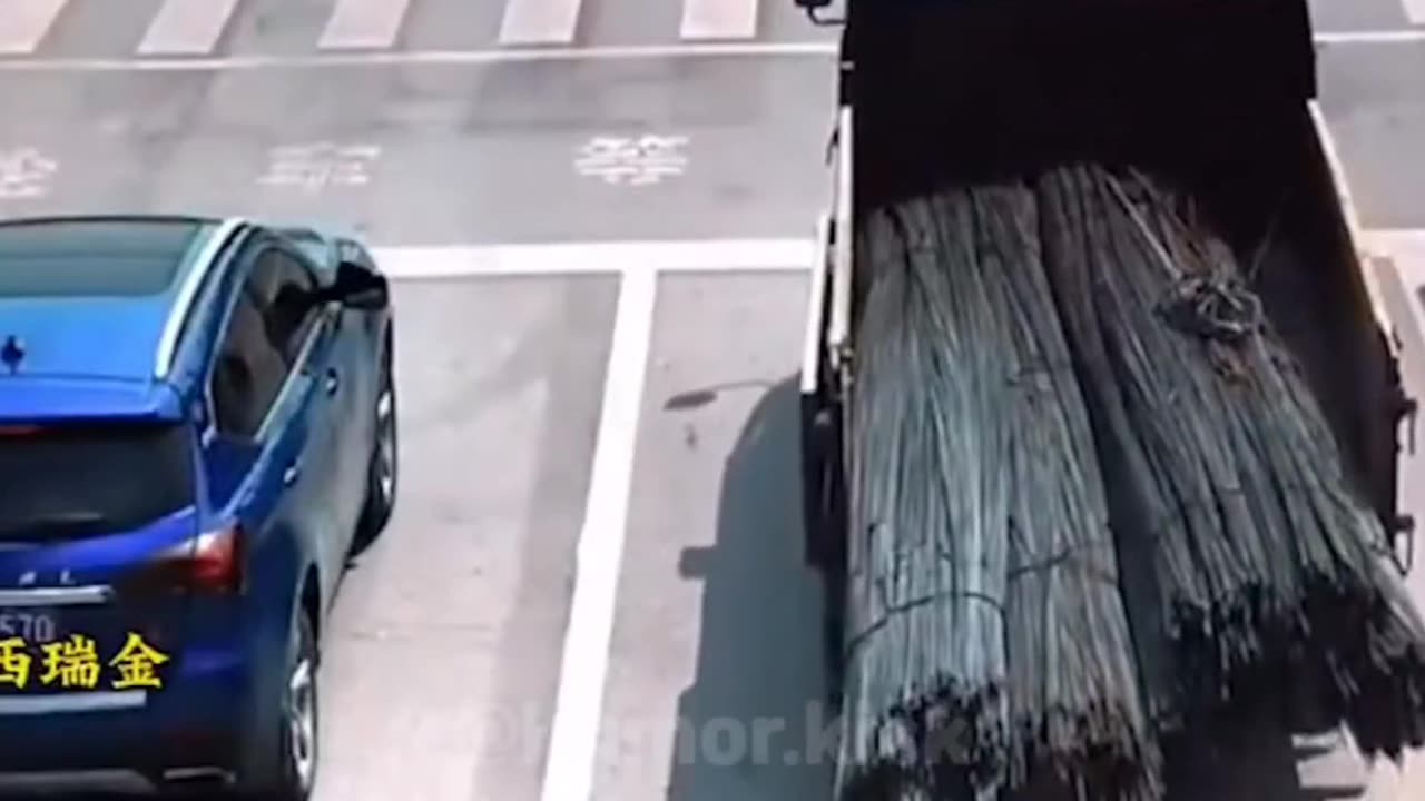 overloaded truck wheel stands at the traffic lights