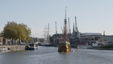 Wide Shot of Imitation Pirate Ship Sailing Through Bristol Marina In Bristol England