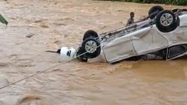 a car drifted by the river