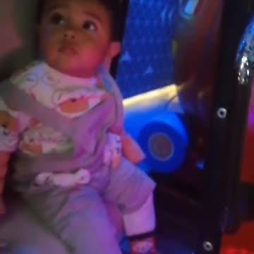 Baby enjoying in joyland