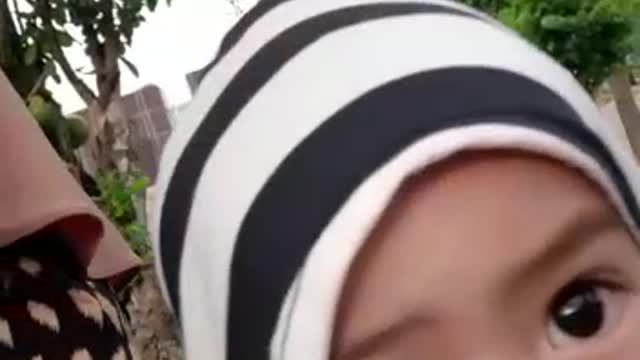 an active little boy who always wants to play with his mother