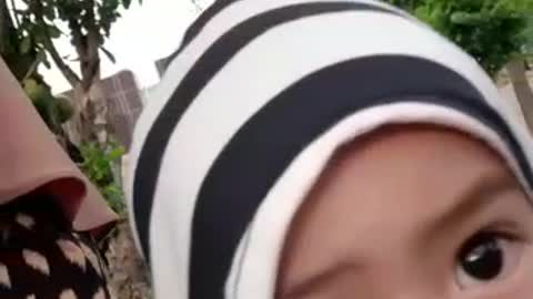 an active little boy who always wants to play with his mother