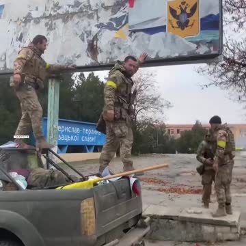Ukrainian soldiers welcomed by residents in Kherson, tear down Russian sign claiming territory
