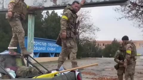 Ukrainian soldiers welcomed by residents in Kherson, tear down Russian sign claiming territory