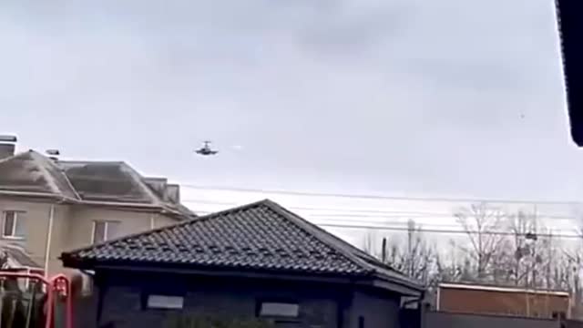Military Attack Helicopter Flys over neighborhood and releases flares while avoiding gunfire