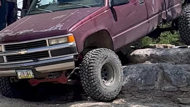 Silverado easing down rocky ledges Tuttle ORV