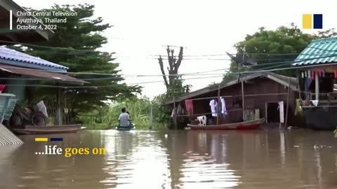 Diners in Thailand enjoy meal in flooded restaurant amid heavy rain season