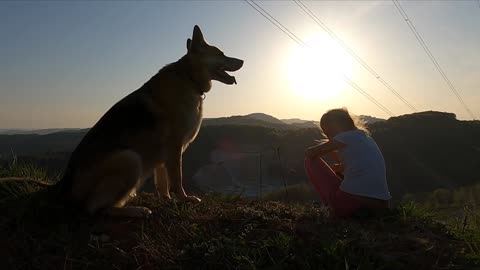 a girl with her dog enjoying nature