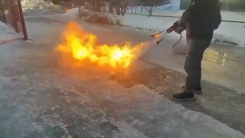 Man Clears Off His Driveway by Melting the Ice with a Flamethrower