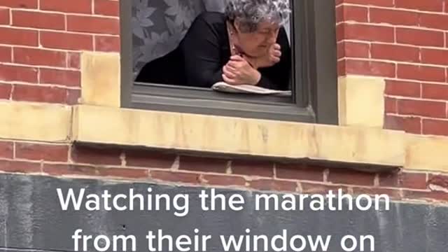 Watching the marathon from their window on Bedford