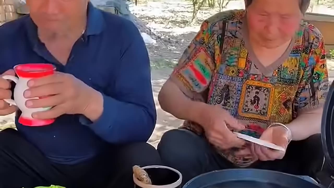 Chinese burger Elderly couple sharing a meal