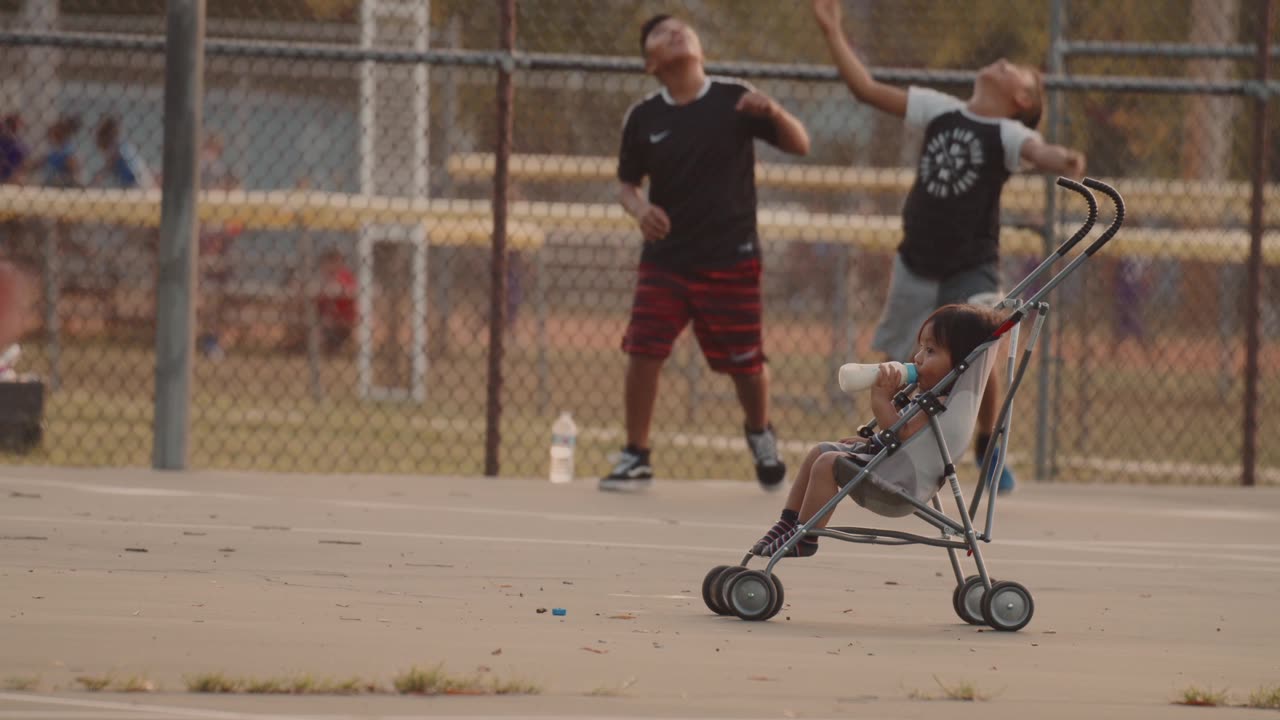 A baby enjoying milk in Stroller Park