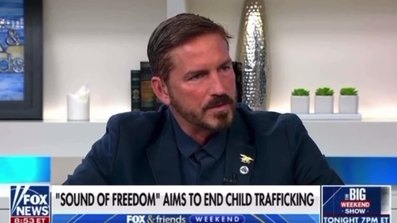 Jim Caviezel handing out red pills about child sex trafficking