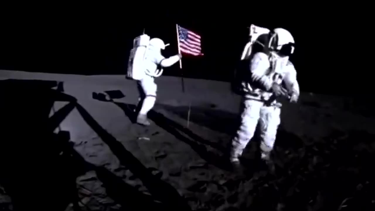 Apollo14 astronauts Alan Shepard and Edgar Mitchell plant an American flag on The Moon, 1971