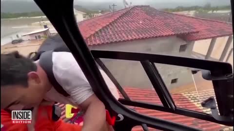 Dramatic Helicopter Rescue of Families Trapped on Rooftops