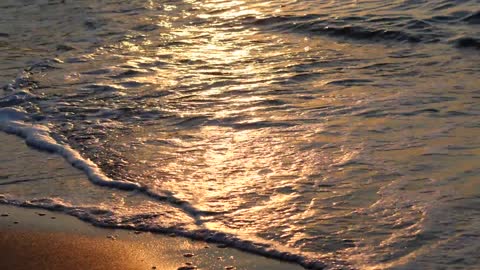 gold sandblasting sunset waves love water and sand