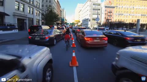 Bike Messenger Riding Fast and Fluid Through NYC Traffic