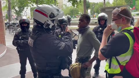 Paris: police officer records faces of civilians
