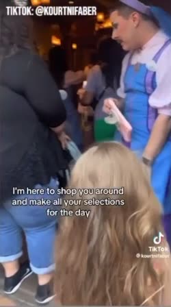 Disneyland Has Men Dressed as a Fairy Godmother Greeting Children in a Dress Store