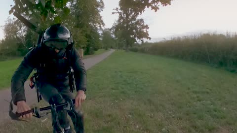 Bicyclist Straps Motor to His Back to Go Fast