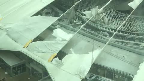 Meanwhile in London, the roof of the O2 arena is partially shredded by the winds from storm Eunice
