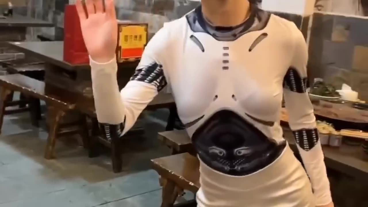 A Realistic Chinese Robot Waiter Enhances Dining Experience in a Chongqing Hotpot Restaurant