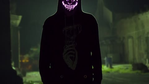 Silhouetted man with LED light mask