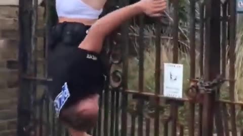 Cop gets stuck on a fence