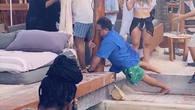 Guy Missteps and Smacks Face on Cabana Pole