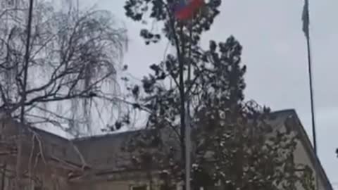 Ukrainians lower the Russian flag