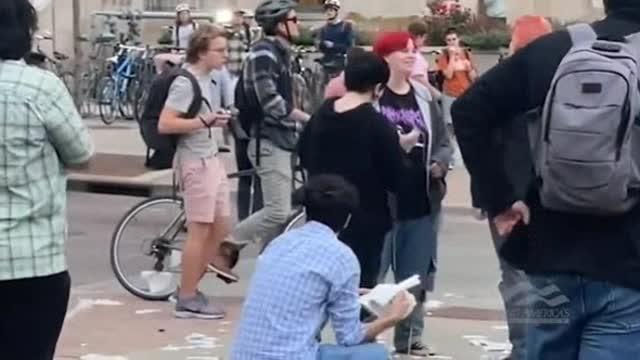 Demonic Leftists Scream at Conservative Reading Holy Bible, Protester Steals His Bible, Rips it Up and Eats Pages