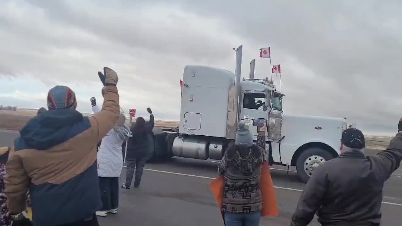 ‘Freedom Rally’: Supporters line the streets to cheer on the truckers in Alberta, Canada