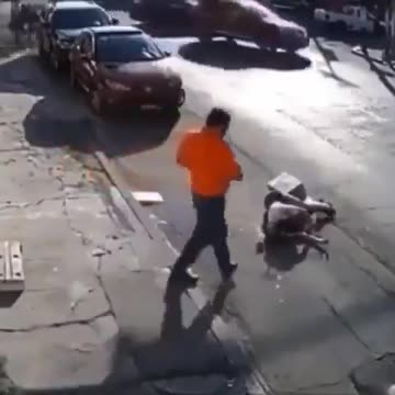 A very strange video. Some kind of unseen force just tosses this person into the street.