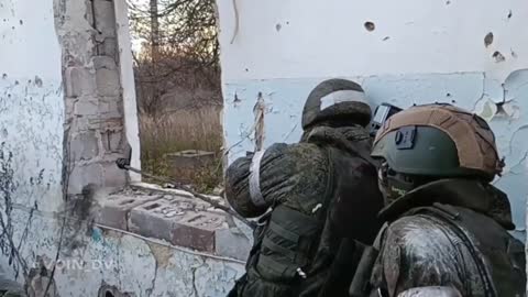 Russian soldiers use a mirror to try to visualize their enemy.