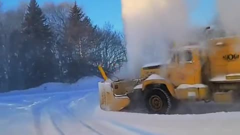 Old SnoGo Truck Launching Snow High into the Air