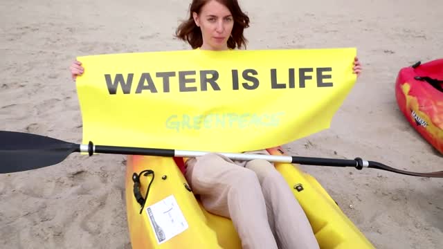 Climate activists protest on the Danube's dry banks