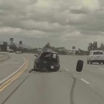 A car was sent flying through the air after being struck by a tire