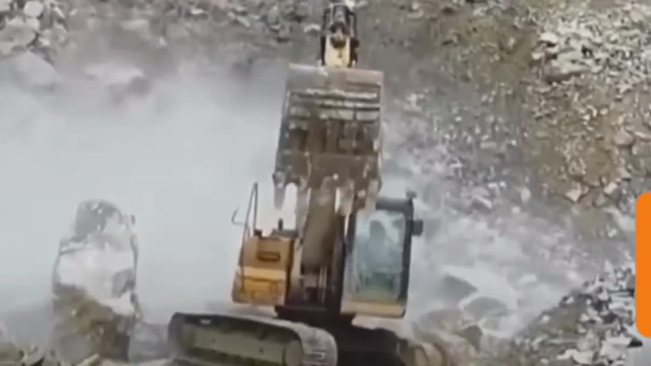 Rocks falling on Excavator .....