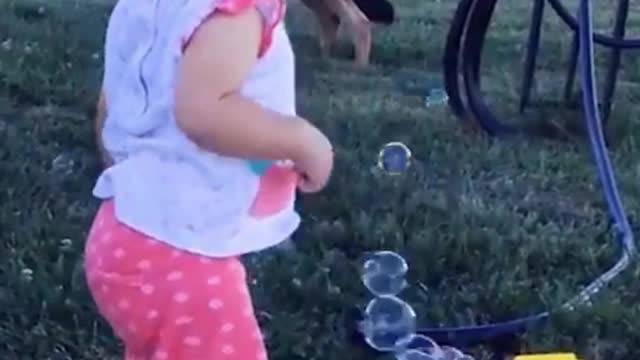 Happy Small Cute Child With Playing Bubble Ball Machine